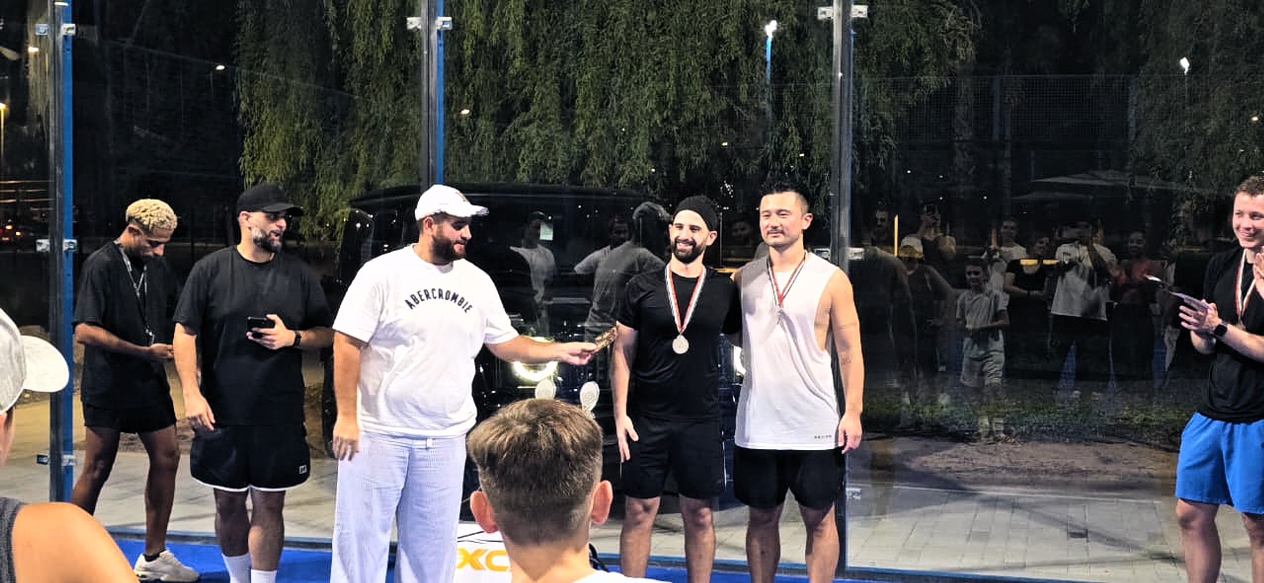Runners Up - Chico and Hui receiving their Silver medals by XCar rental representative Soltan
